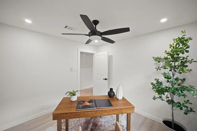 a room with a sink and a mirror