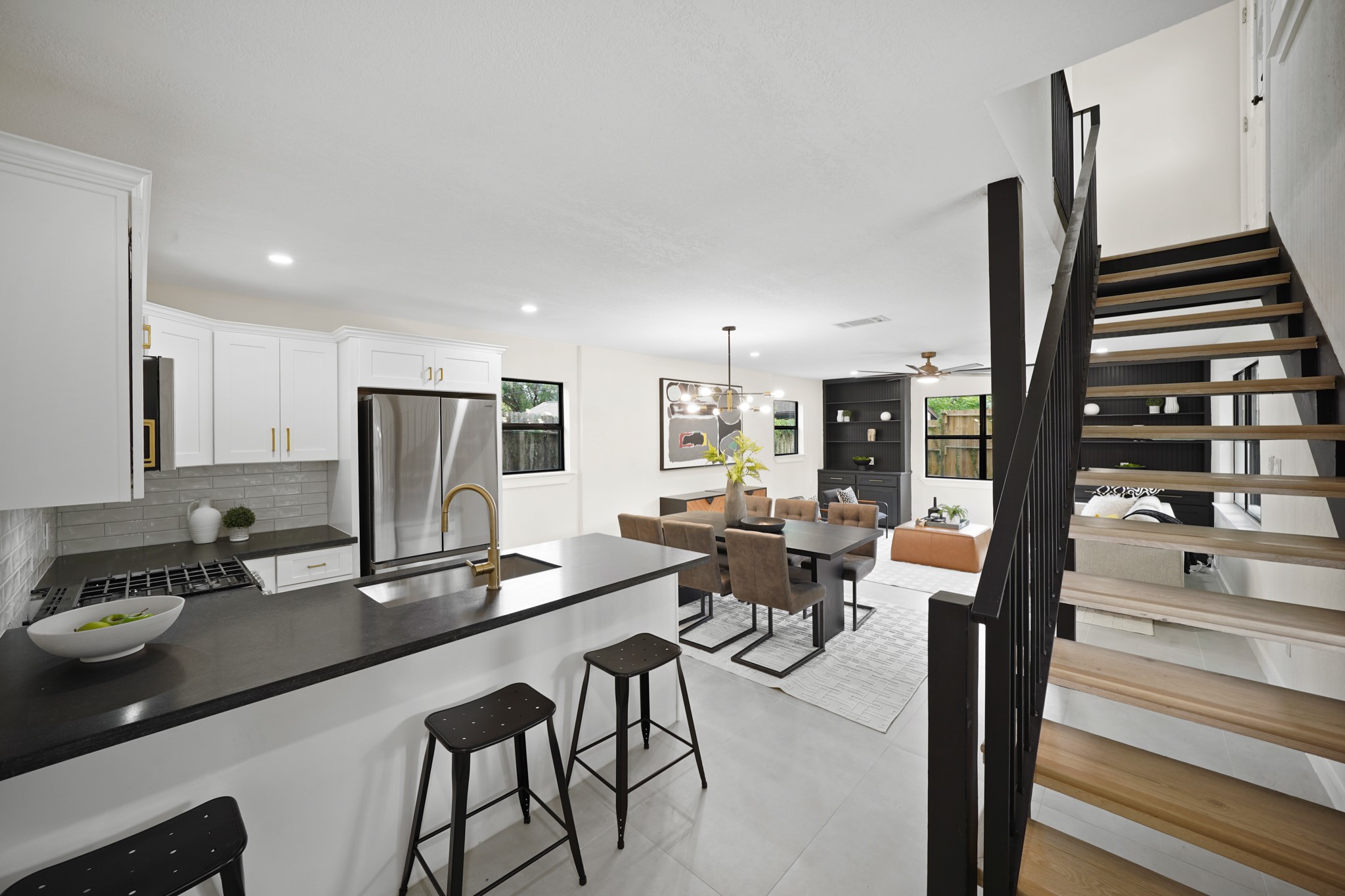 4813 Hummingbird Street Houston, TX 77035 - Photo 48 of 50 a kitchen with stainless steel appliances kitchen island granite countertop a stove and a refrigerator