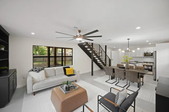 a living room with furniture and a window
