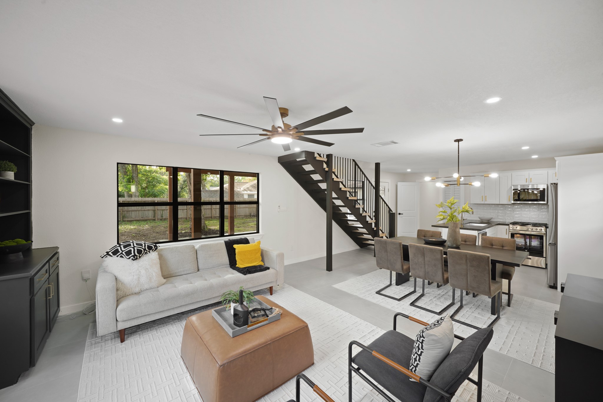 4813 Hummingbird Street Houston, TX 77035 - Photo 27 of 50 a living room with furniture and a large window