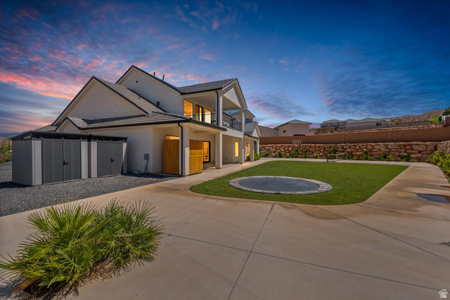 1192 East Corral Way Washington, UT 84780 - Photo 62 of 81 Expansive concrete patio with a manicured lawn area