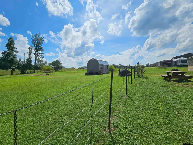 a view of a garden from a balcony
