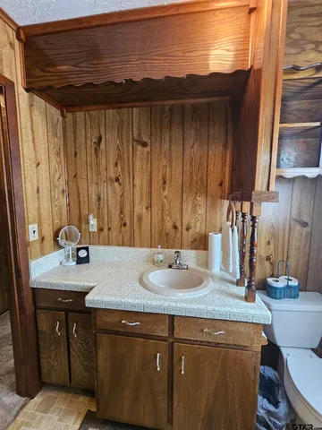 a bedroom with a bed and a mirror