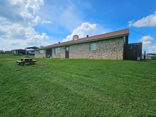 a view of a back yard of the house