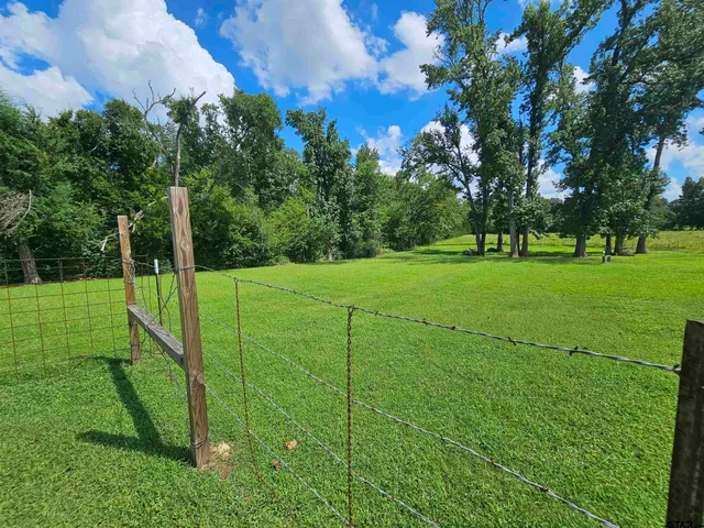 a view of a golf course with a big yard