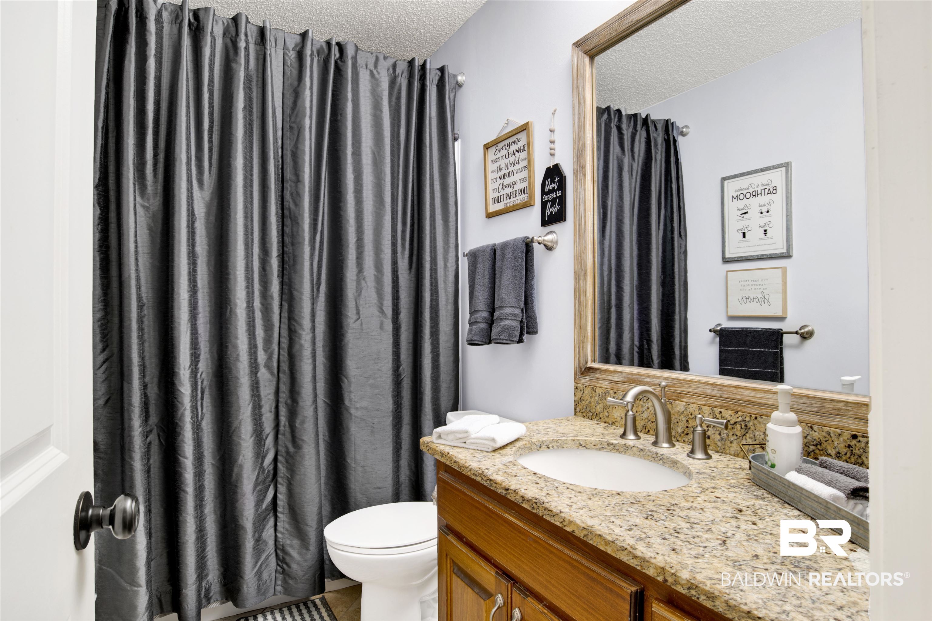 13385 Tom Gaston Road Mobile, AL 36695 - Photo 23 of 42 Bathroom with a shower with curtain, vanity, toilet, and a textured ceiling