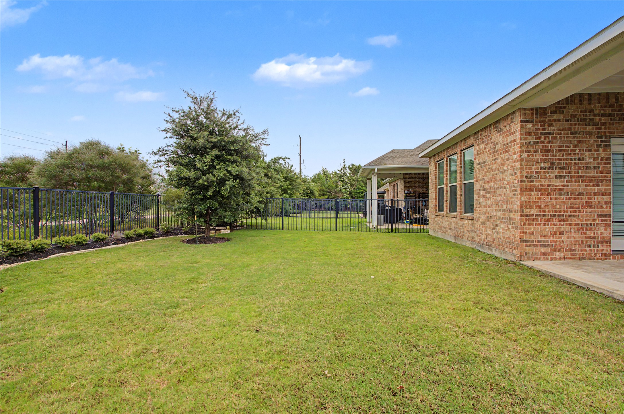 19718 Shinnery Ridge Court Cypress, TX 77433 - Photo 20 of 23 a view of a house with a backyard