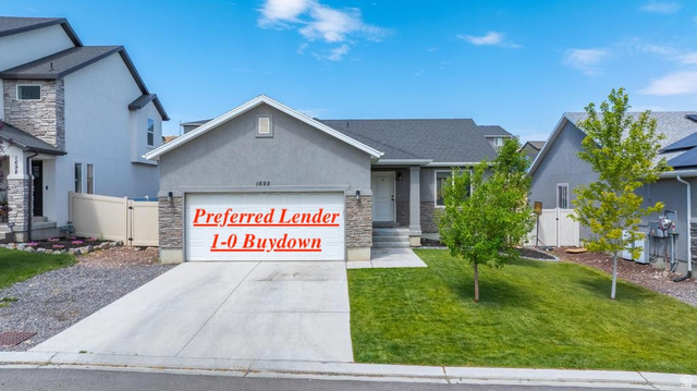 1692 South Windemere Road Santaquin, UT 84655 - Photo 1 of 23 Contemporary exterior with a gray stucco finish and stone accents