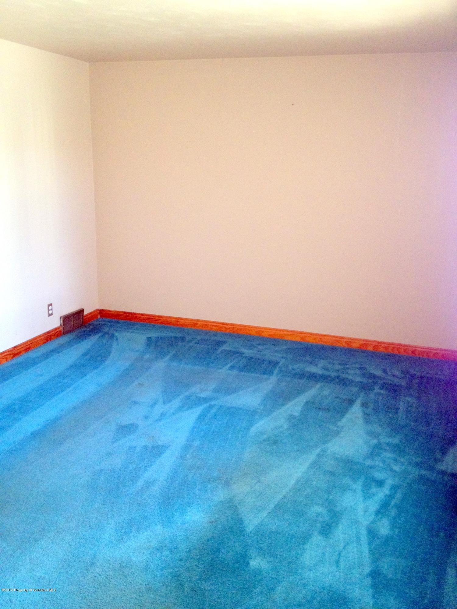 125 Corcoran Street Old Forge, PA 18518 - Photo 11 of 36 a view of empty room with wooden floor