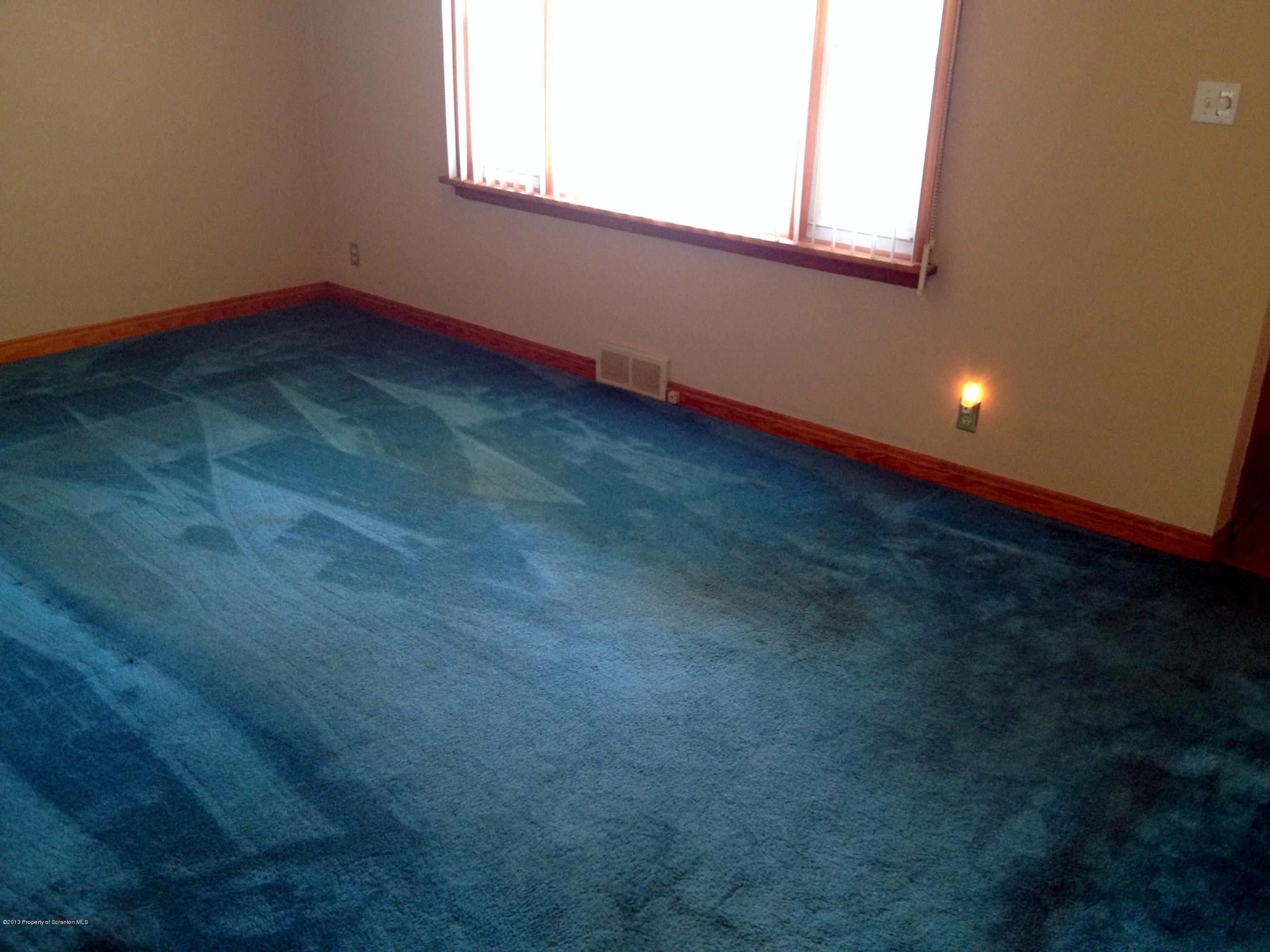 125 Corcoran Street Old Forge, PA 18518 - Photo 12 of 36 a view of an empty room with a window