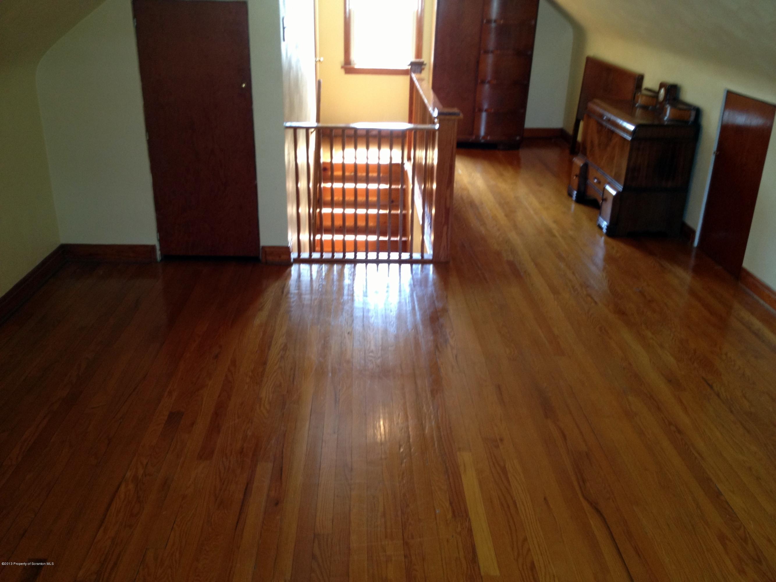 125 Corcoran Street Old Forge, PA 18518 - Photo 18 of 36 a view of a livingroom with hardwood floor and a window