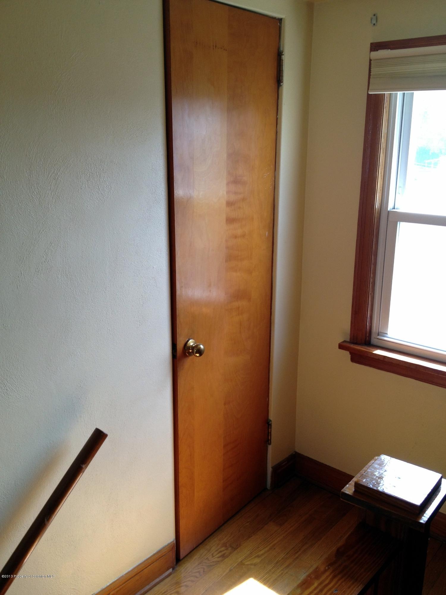 125 Corcoran Street Old Forge, PA 18518 - Photo 19 of 36 an empty room with windows