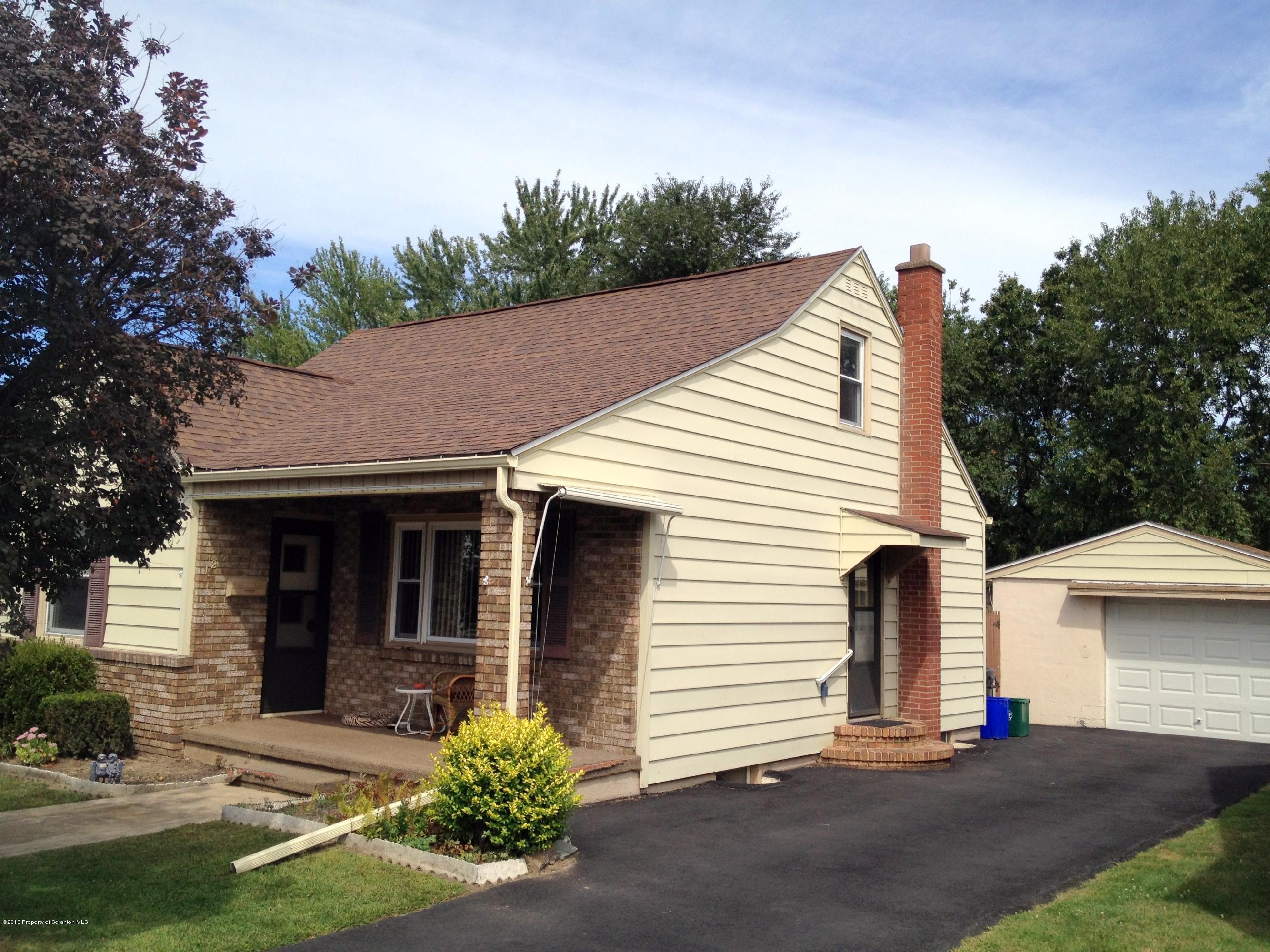 125 Corcoran Street Old Forge, PA 18518 - Photo 2 of 36 a front view of a house with a yard