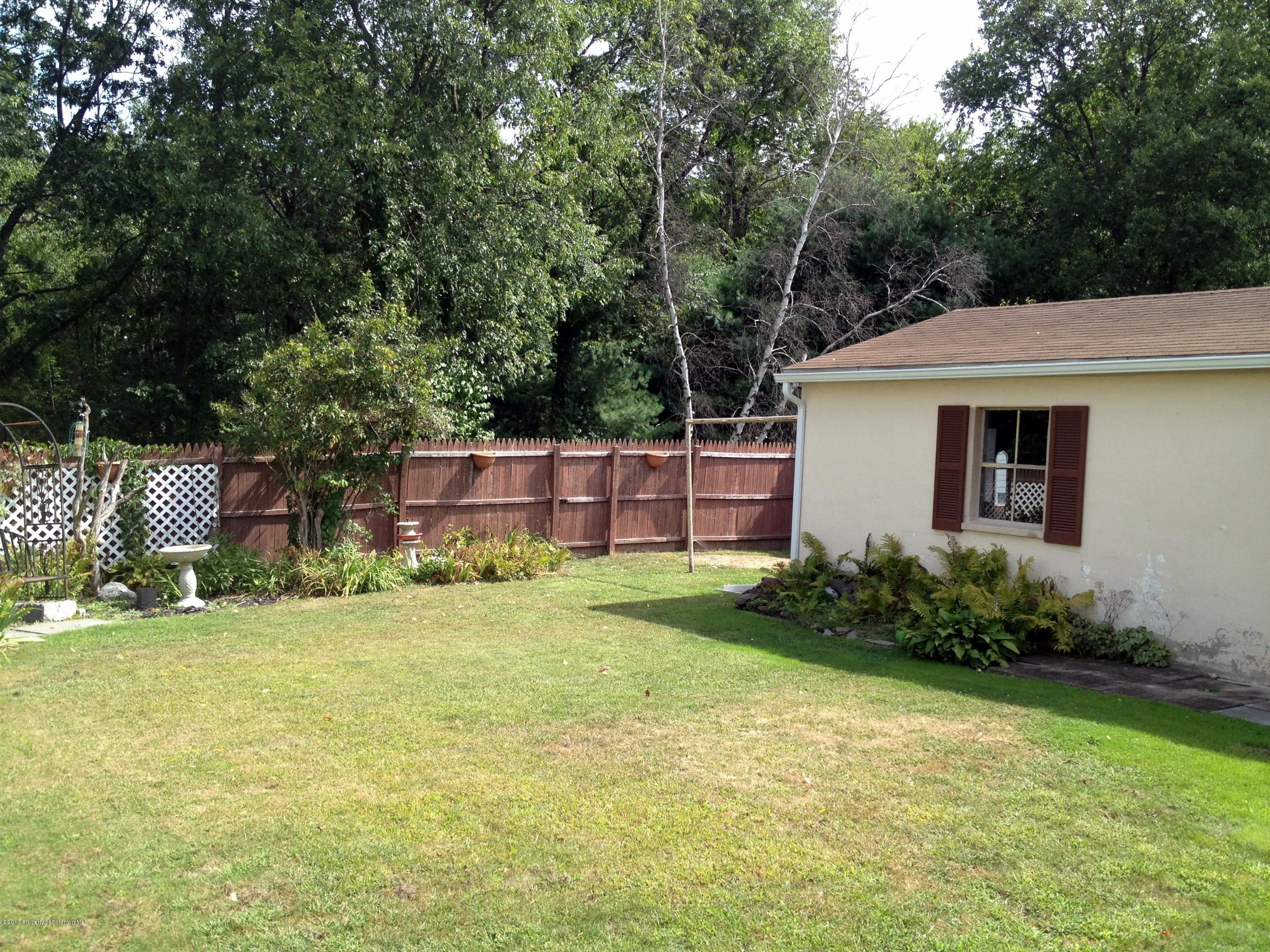 125 Corcoran Street Old Forge, PA 18518 - Photo 5 of 36 a house view with a garden space