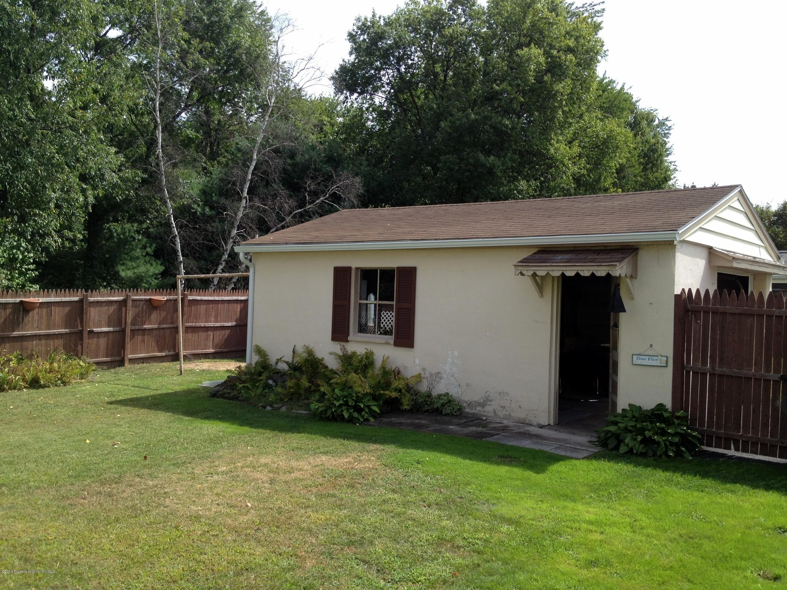 125 Corcoran Street Old Forge, PA 18518 - Photo 6 of 36 a view of a house with backyard and garden