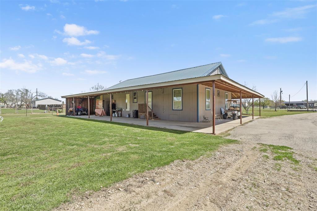 1556 John Wayne Road Kaufman, TX 75142 - Photo 18 of 33 a front view of a house with a garden