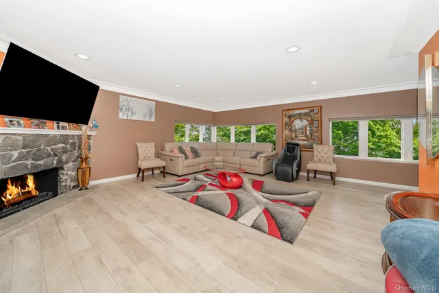 a bedroom with furniture and a flat screen tv