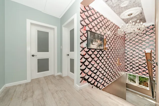 a view of entryway with wooden floor