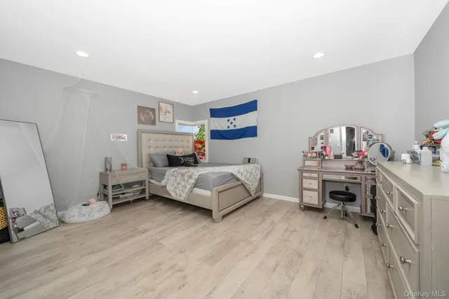 a bedroom with a bed and dresser