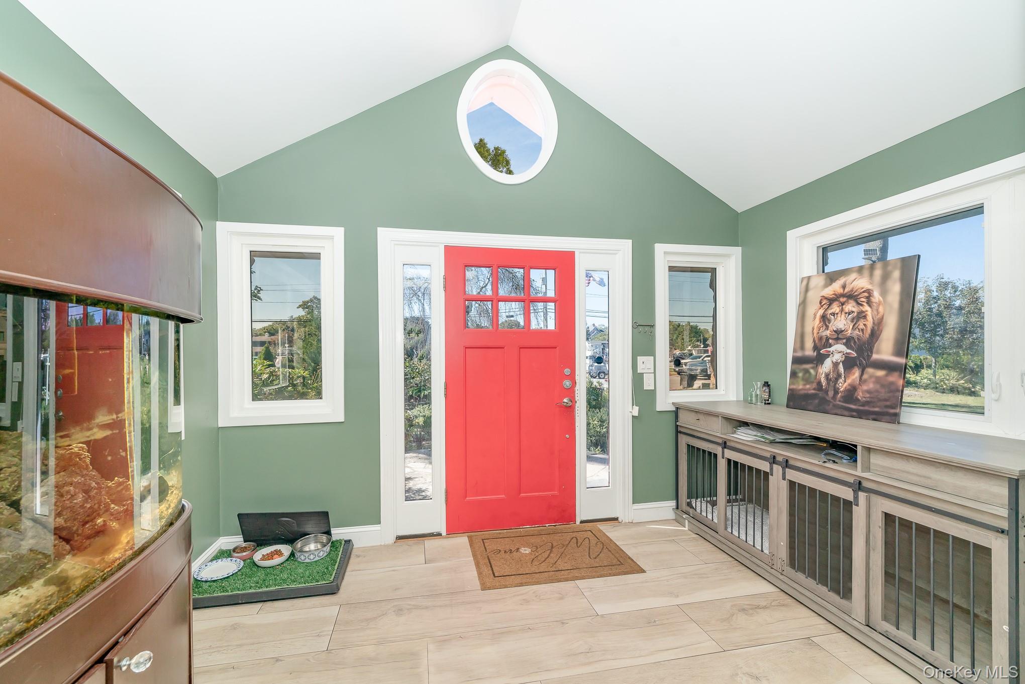 28 Riverside Avenue Amityville, NY 11701 - Photo 5 of 31 a kitchen with stainless steel appliances granite countertop a stove a sink and a microwave