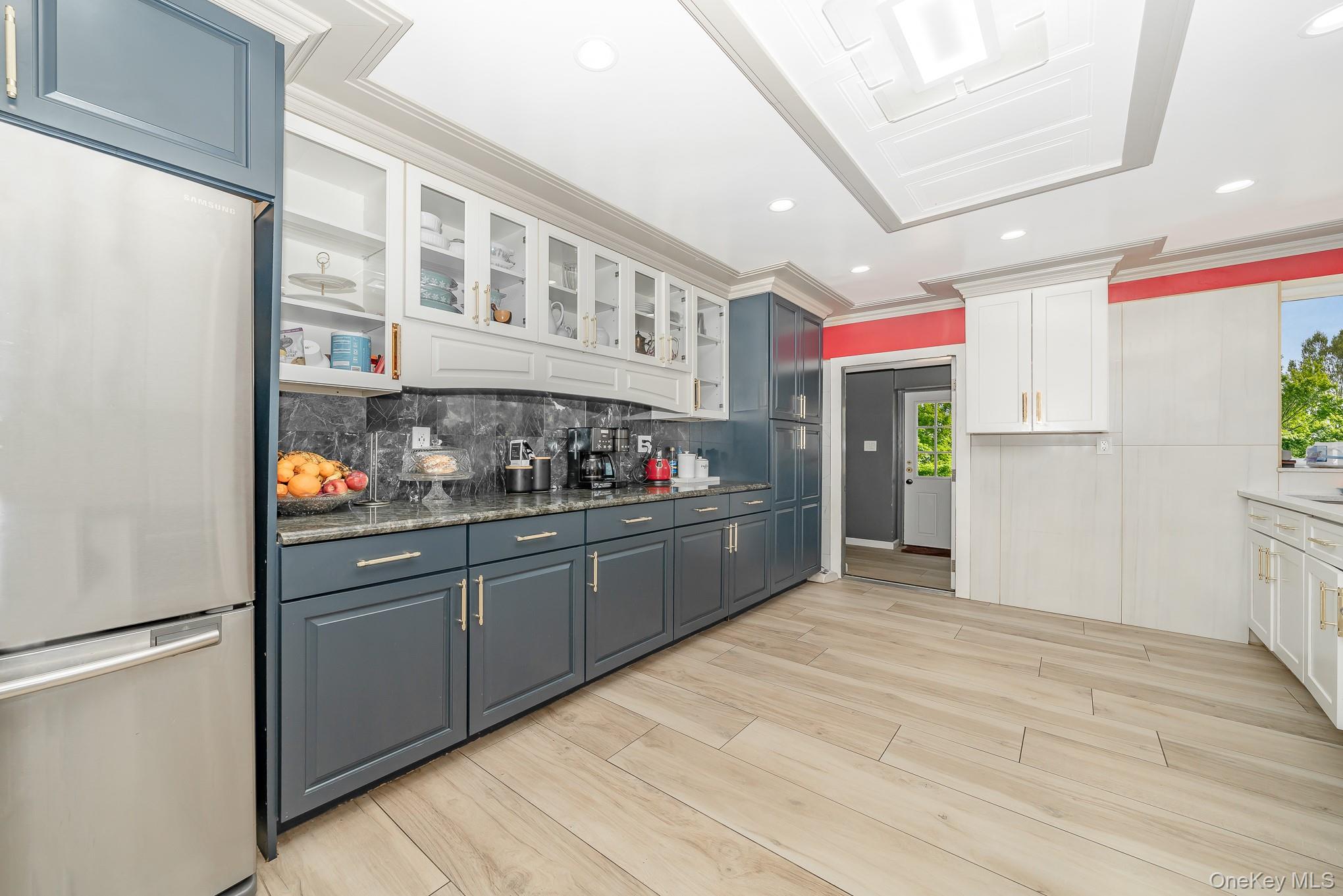 28 Riverside Avenue Amityville, NY 11701 - Photo 6 of 31 a kitchen with stainless steel appliances granite countertop a refrigerator and a stove top oven
