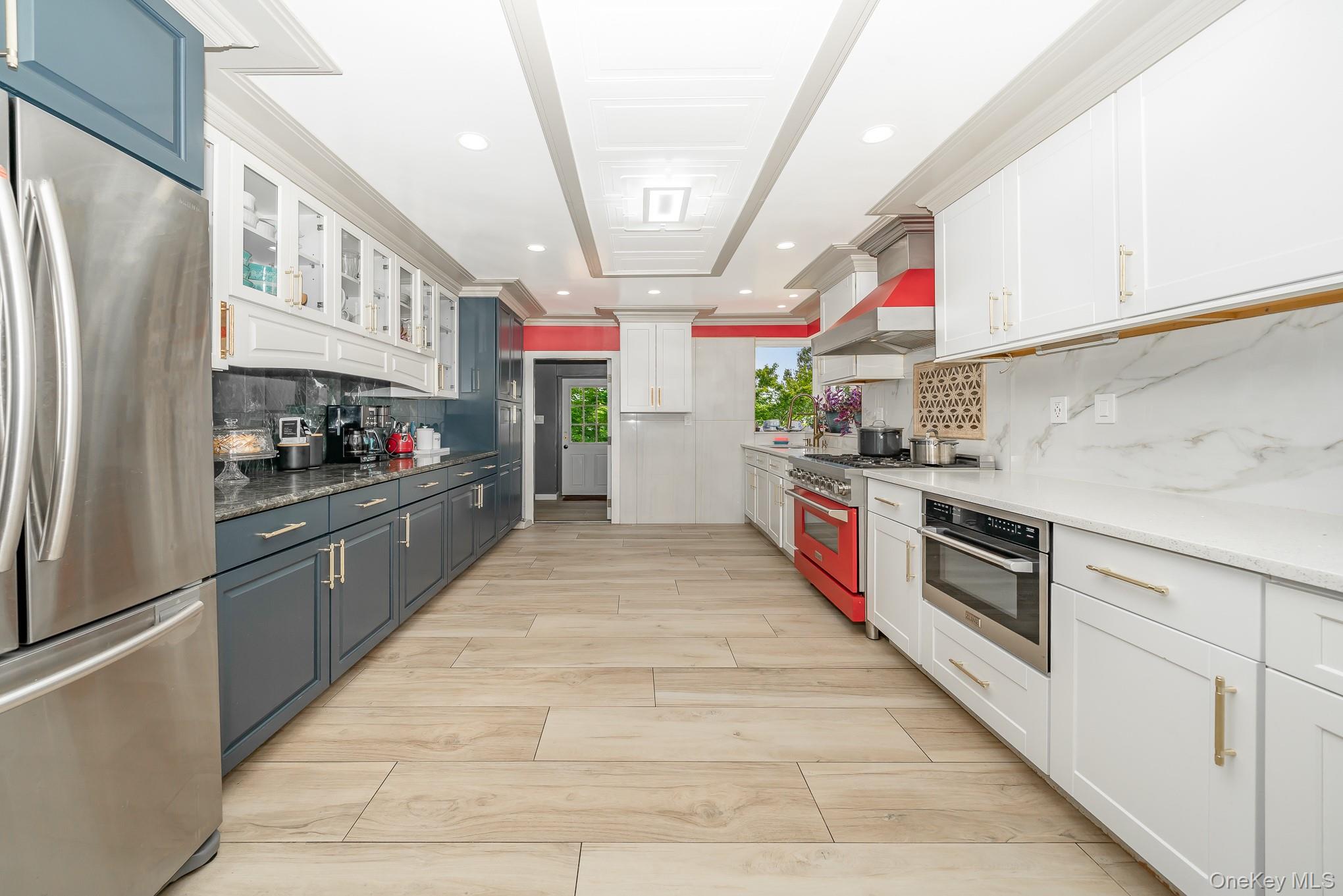 28 Riverside Avenue Amityville, NY 11701 - Photo 8 of 31 a kitchen with stainless steel appliances granite countertop lots of counter top space and cabinets