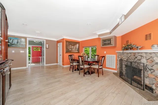 a dining room with furniture and fireplace