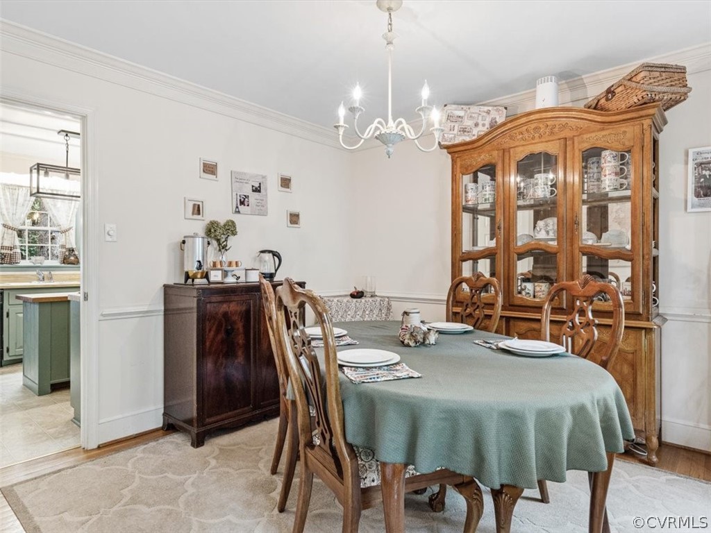 13916 Sterlings Bridge Road Midlothian, VA 23112 - Photo 20 of 36 a view of a dining room with furniture and chandelier