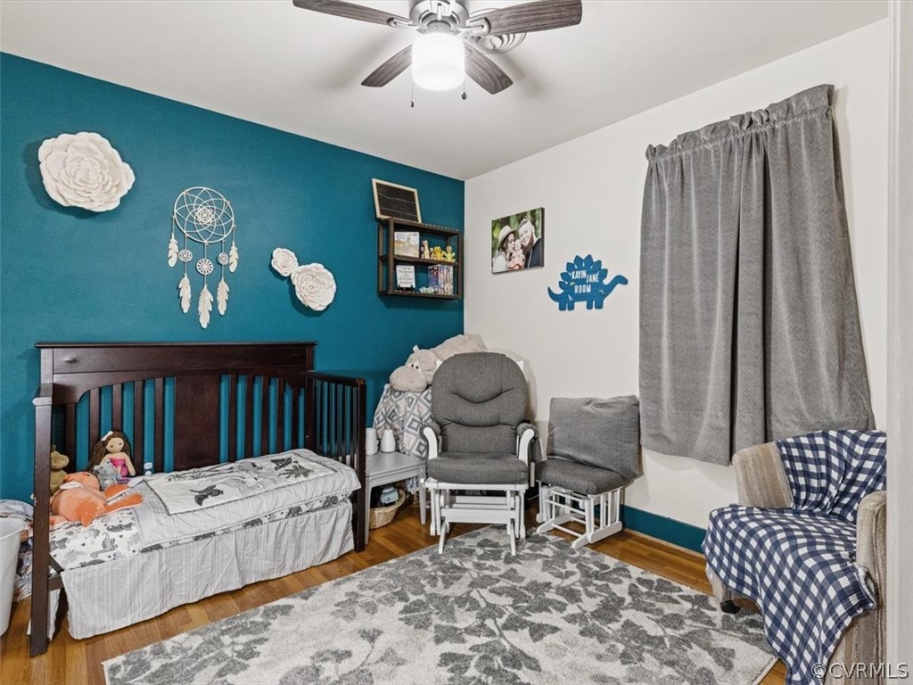 13916 Sterlings Bridge Road Midlothian, VA 23112 - Photo 26 of 36 a bedroom with a bed and a chandelier