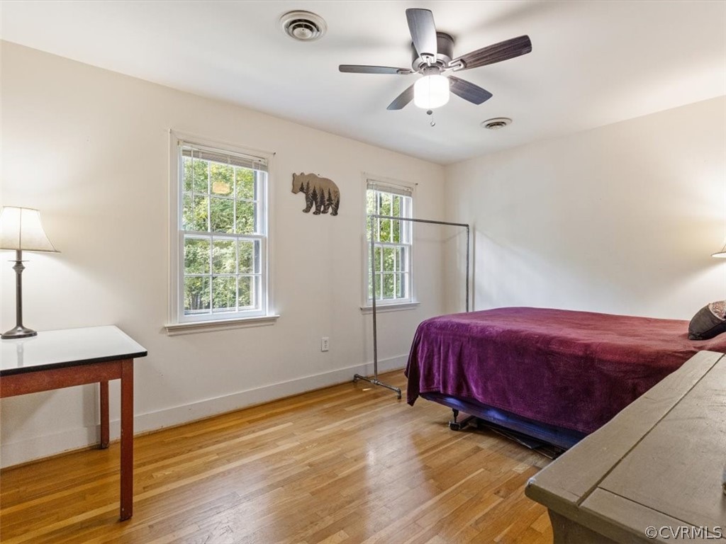 13916 Sterlings Bridge Road Midlothian, VA 23112 - Photo 27 of 36 a living room with a bed furniture and a window