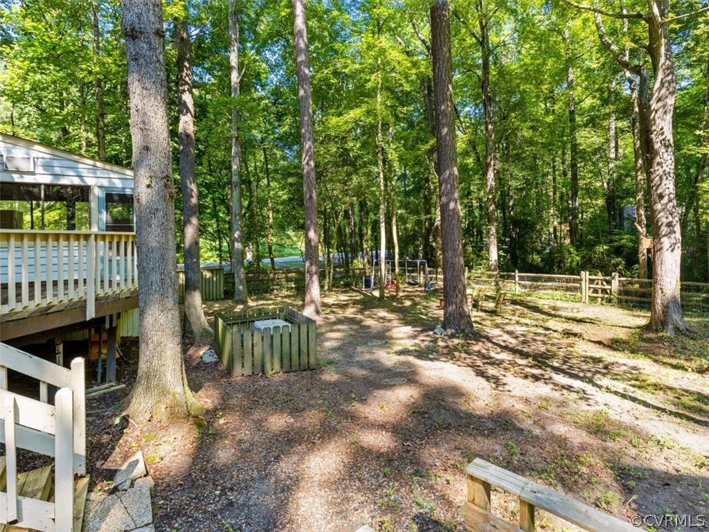 13916 Sterlings Bridge Road Midlothian, VA 23112 - Photo 35 of 36 a view of a yard with plants and trees