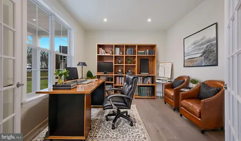 a work room with furniture and a window