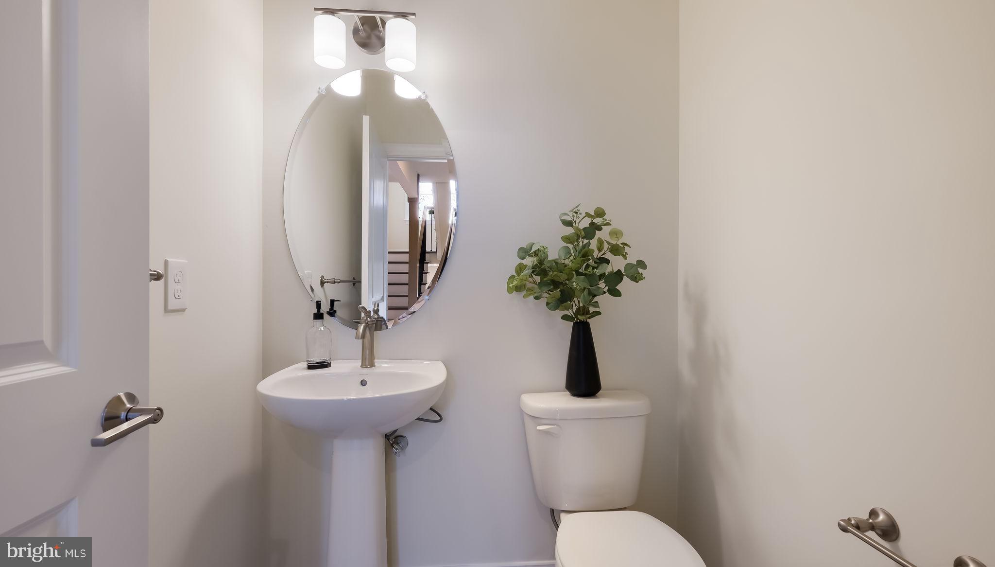 321 Green Top Road, Unit 7 Quakertown, PA 18951 - Photo 12 of 41 a bathroom with a toilet sink and mirror