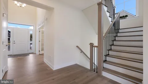 a view of entryway with wooden floor