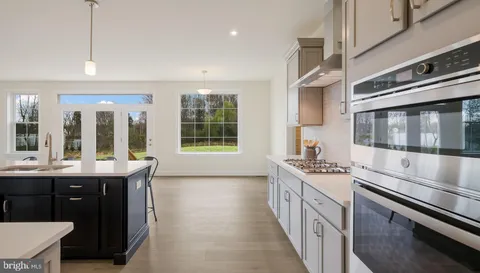 a kitchen with a stove and a sink