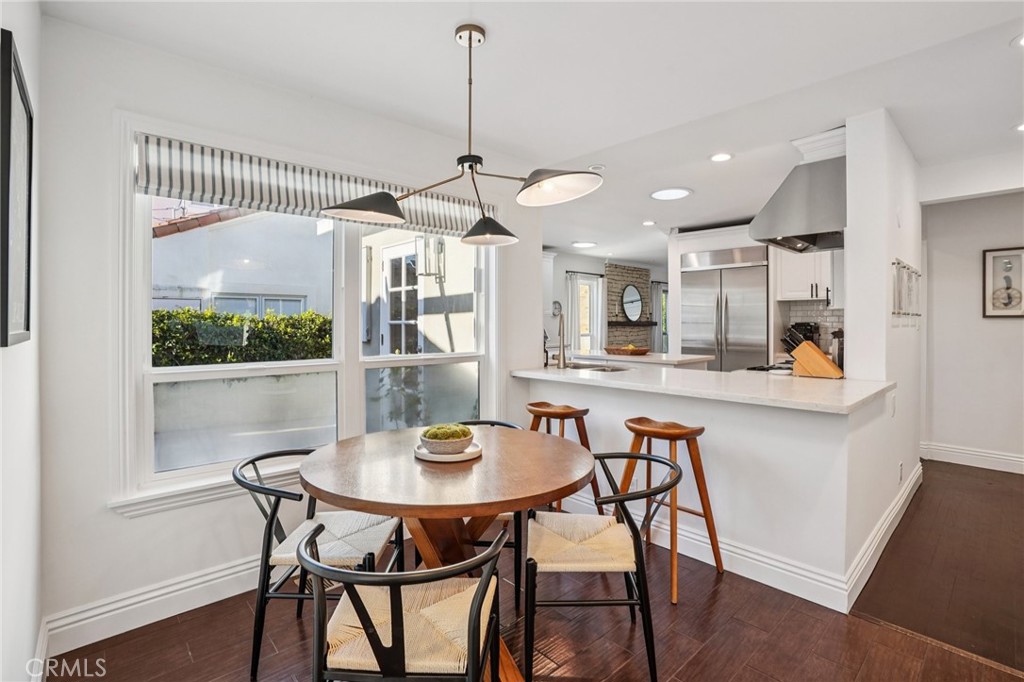 1237 South Gertruda Avenue Redondo Beach, CA 90277 - Photo 12 of 52 a kitchen with a dining table and chairs