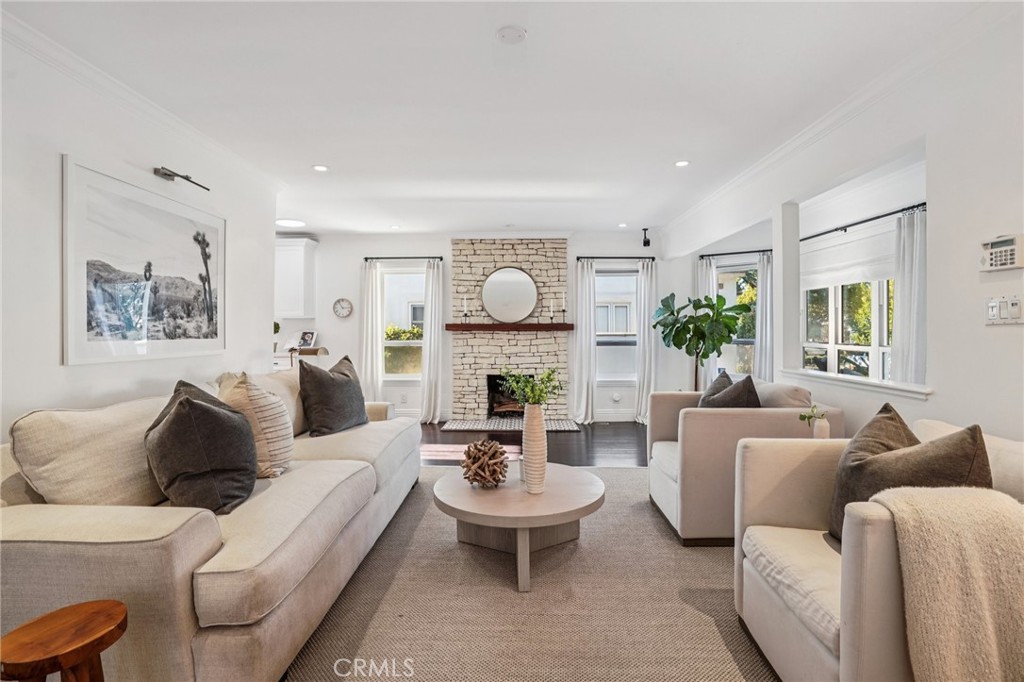 1237 South Gertruda Avenue Redondo Beach, CA 90277 - Photo 2 of 52 a living room with furniture a fireplace and a window