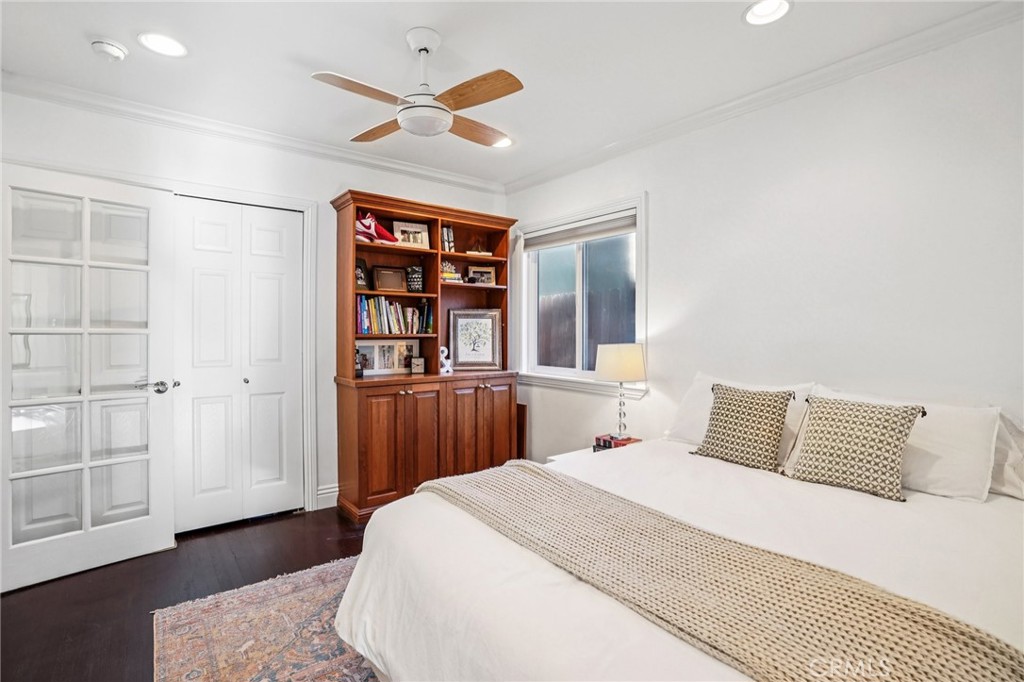 1237 South Gertruda Avenue Redondo Beach, CA 90277 - Photo 22 of 52 a bedroom with a large bed and a chandelier