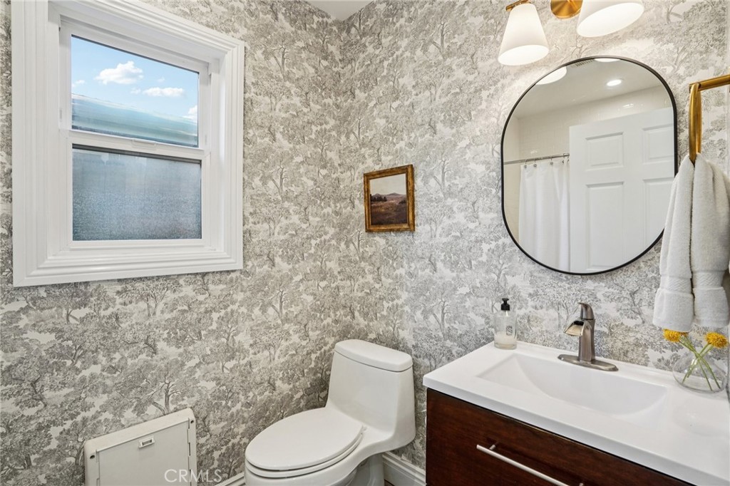 1237 South Gertruda Avenue Redondo Beach, CA 90277 - Photo 23 of 52 a bathroom with a toilet a sink and mirror
