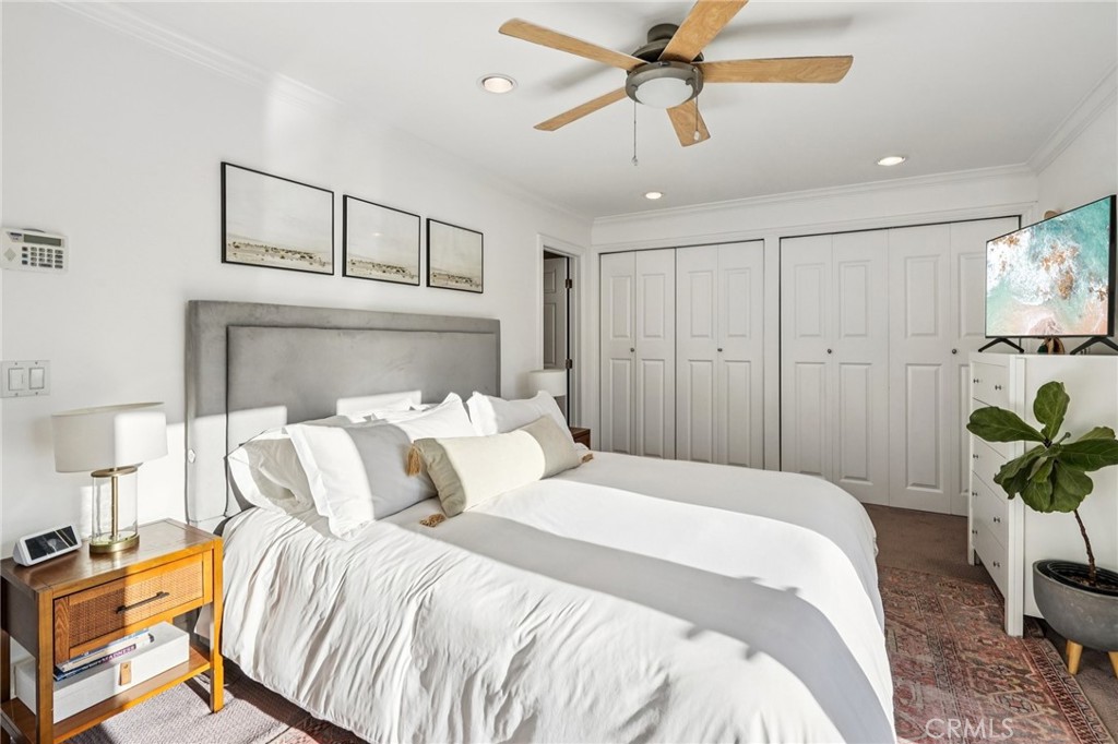 1237 South Gertruda Avenue Redondo Beach, CA 90277 - Photo 31 of 52 a bedroom with a bed and a chandelier