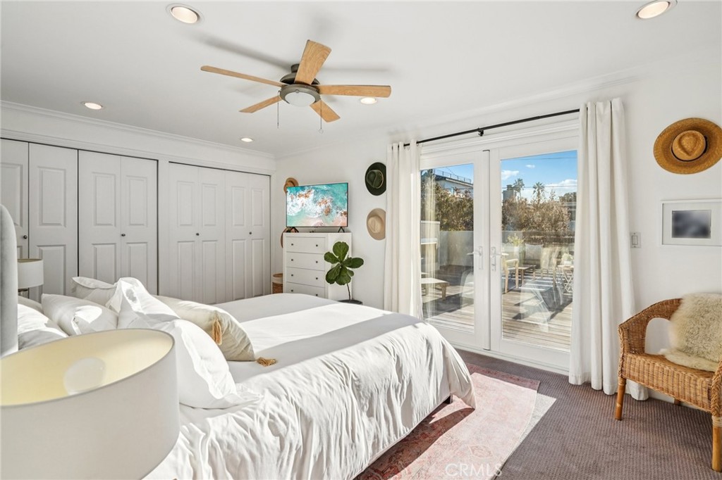 1237 South Gertruda Avenue Redondo Beach, CA 90277 - Photo 32 of 52 a bedroom with a large bed and a chandelier