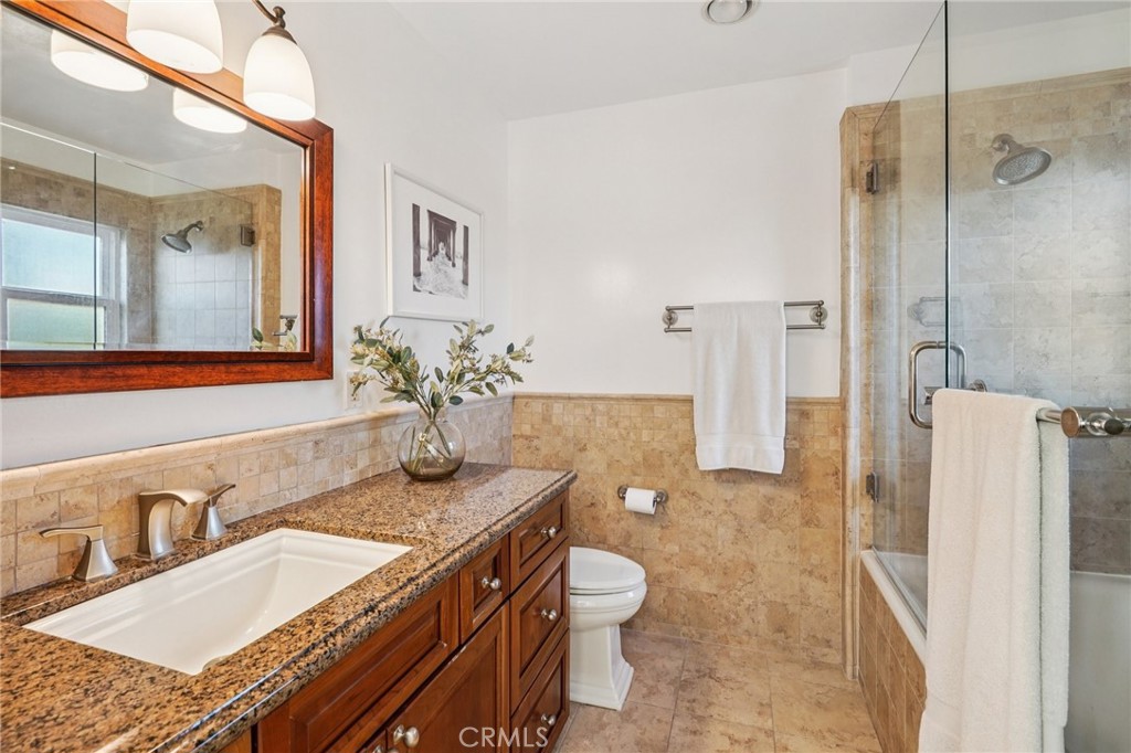 1237 South Gertruda Avenue Redondo Beach, CA 90277 - Photo 35 of 52 a bathroom with a granite countertop sink and a mirror