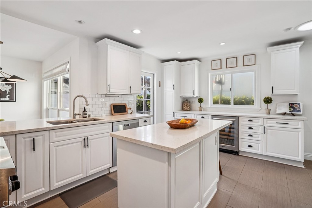 1237 South Gertruda Avenue Redondo Beach, CA 90277 - Photo 10 of 52 a kitchen with white cabinets sink and stove
