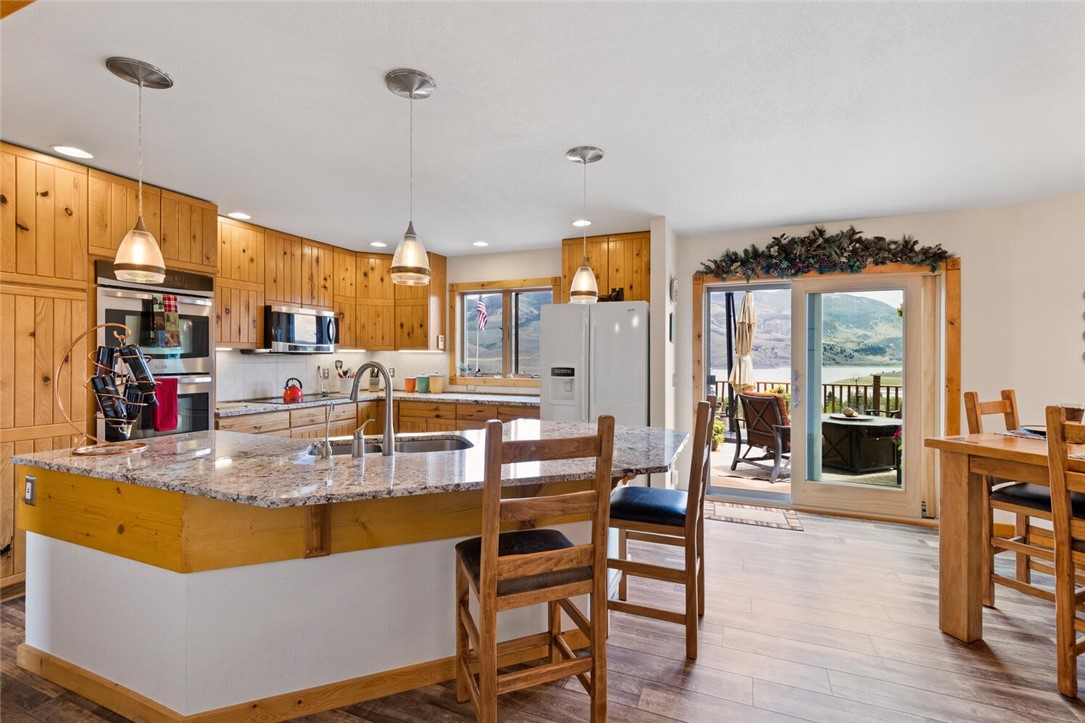6015 Heeney Road Silverthorne, CO 80498 - Photo 5 of 35 Nicely updated kitchen with newer appliance, granite countertops and flooring.