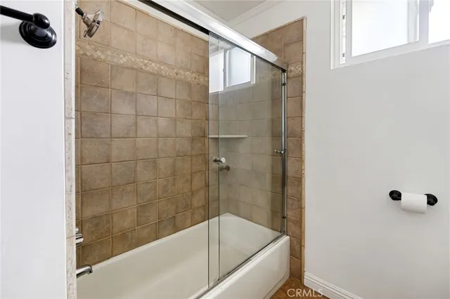 a bathroom with a bathtub and a shower