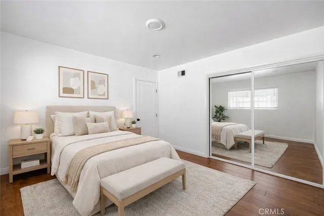 a bedroom with a bed and a chair