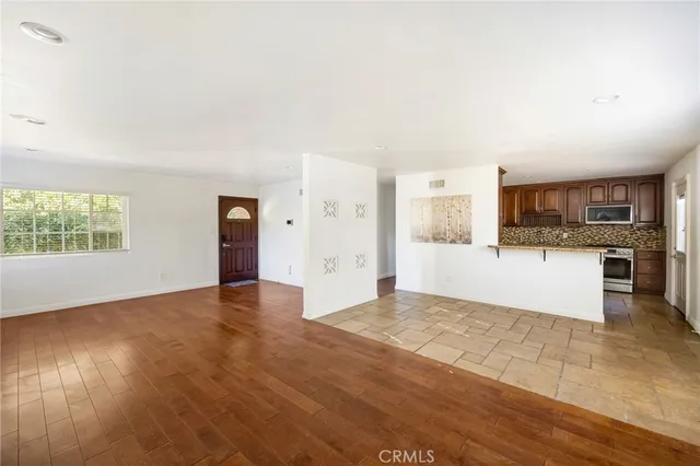 a view of a kitchen with a sink and a stove top oven
