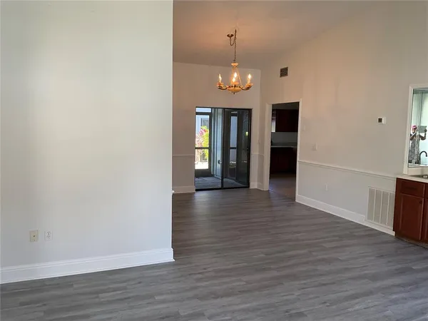 a view of a livingroom with wooden floor