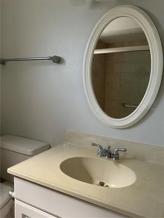 a bathroom with a sink and mirror