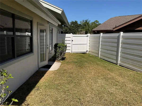 a view of a backyard of the house